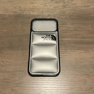 The North Face Silver Padded Phone Case With Logo for an iPhone 17 Pro Max!
